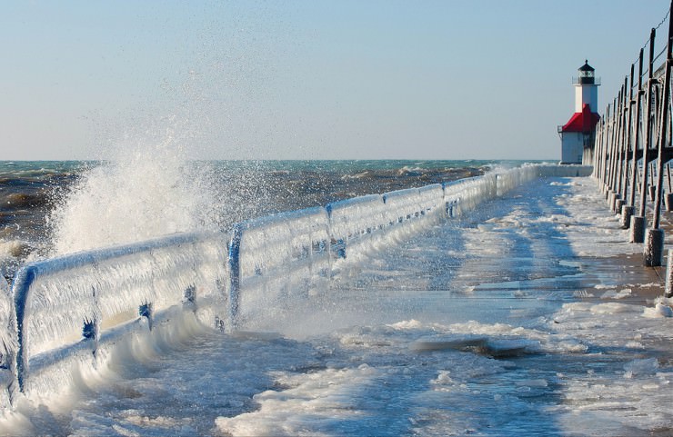 Frozen St. Joseph North Pier on Lake Michigan, USA