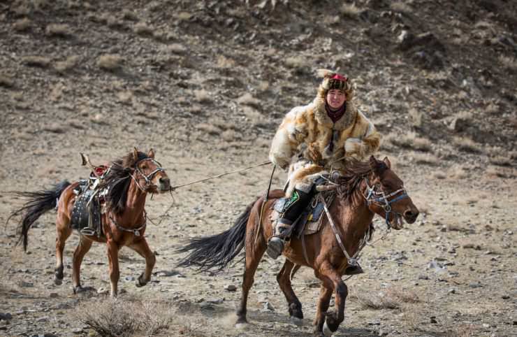 Horse rider in Mongolia © Katiekk | Shutterstock, Inc.