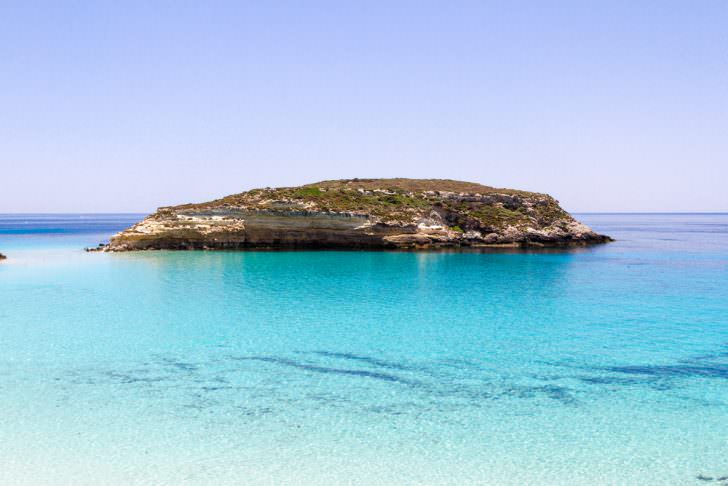 Pure crystalline water surface around an island Lampedusa