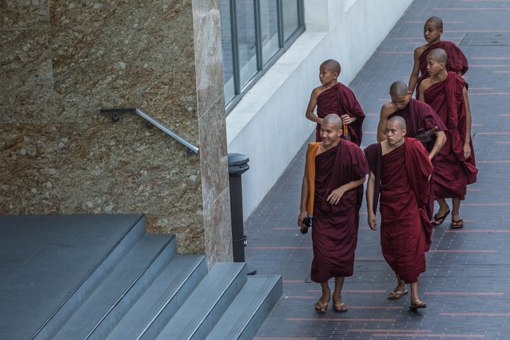 Young monks exploring downtown