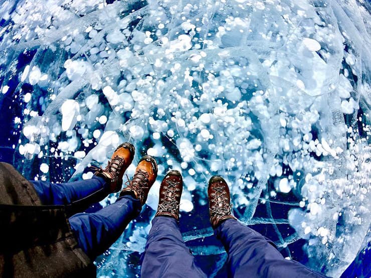 Standing on ice bubbles Abraham Lake