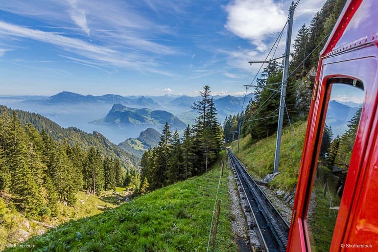 The Pilatus train, the world's steepest cogwheel railway nears the top of Mount Pilatus as it emerges from the clouds