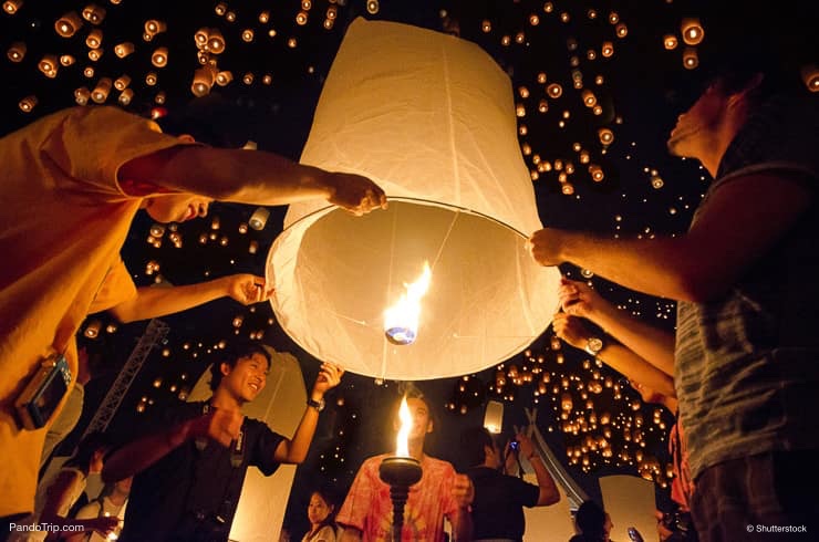 People are launching sky lanterns during Yi Peng and Loy Krathong festivals