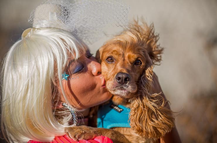 Girls kisses a dog at Burning Man Festival