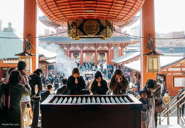 Praying at Senso-ji in Asakusa, Tokyo, Japan
