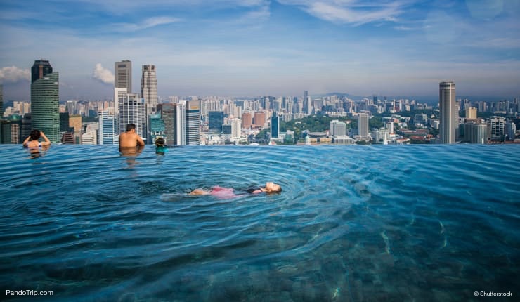 Swimming in rooftop infinity pool at the Marina Bay Sands Hotel in Singapore
