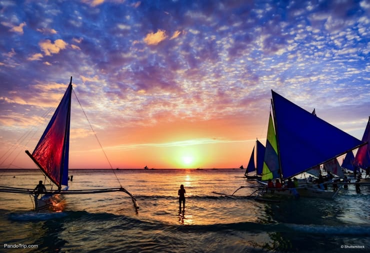 Sunset Sailing at the famous White Beach of the Boracay Island, Philippines