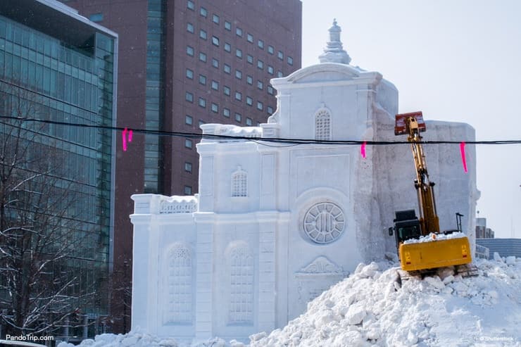 Demolition of snow sculptures immediately after Sapporo Snow Festival. Sapporo, Hokkaido, Japan