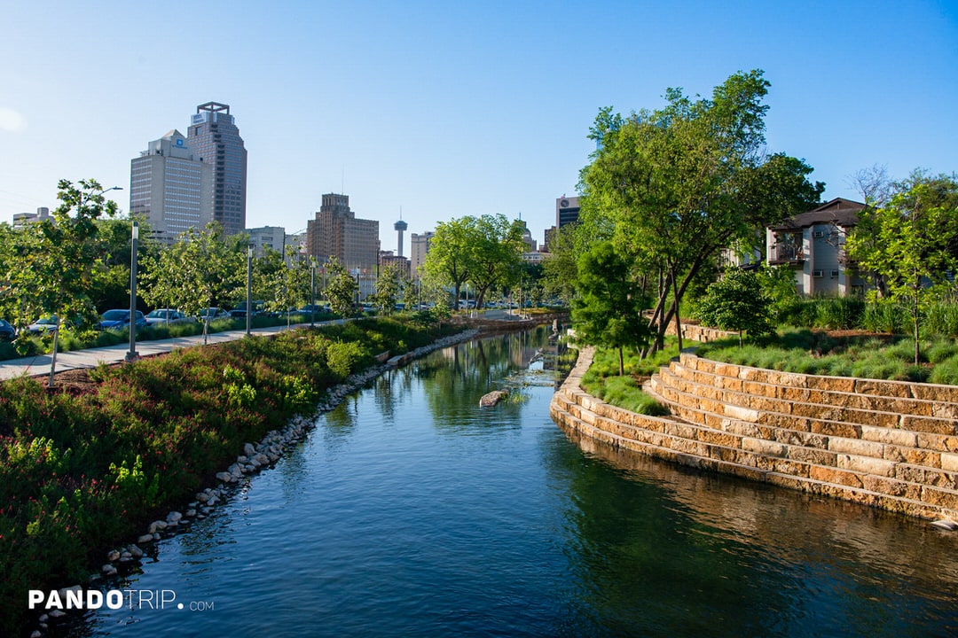 San Pedro Creek surrounded by greenery and stone terraces