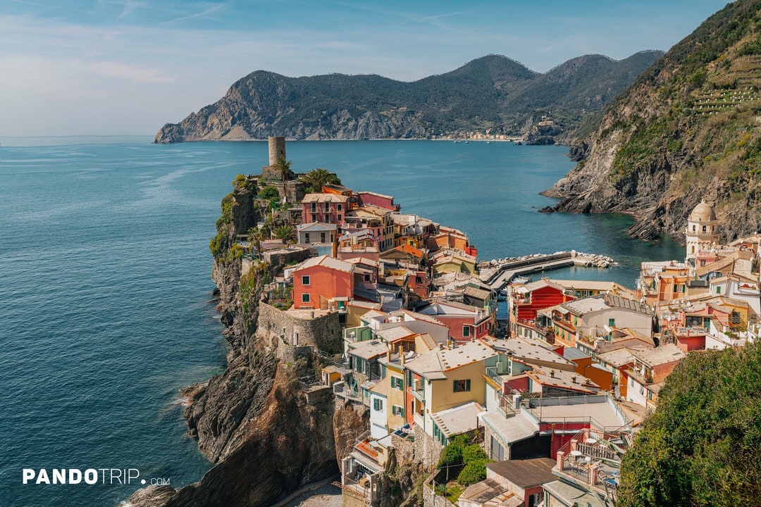 View of Vernazza from above, featuring the Doria Tower and dramatic cliffs overlooking the sea