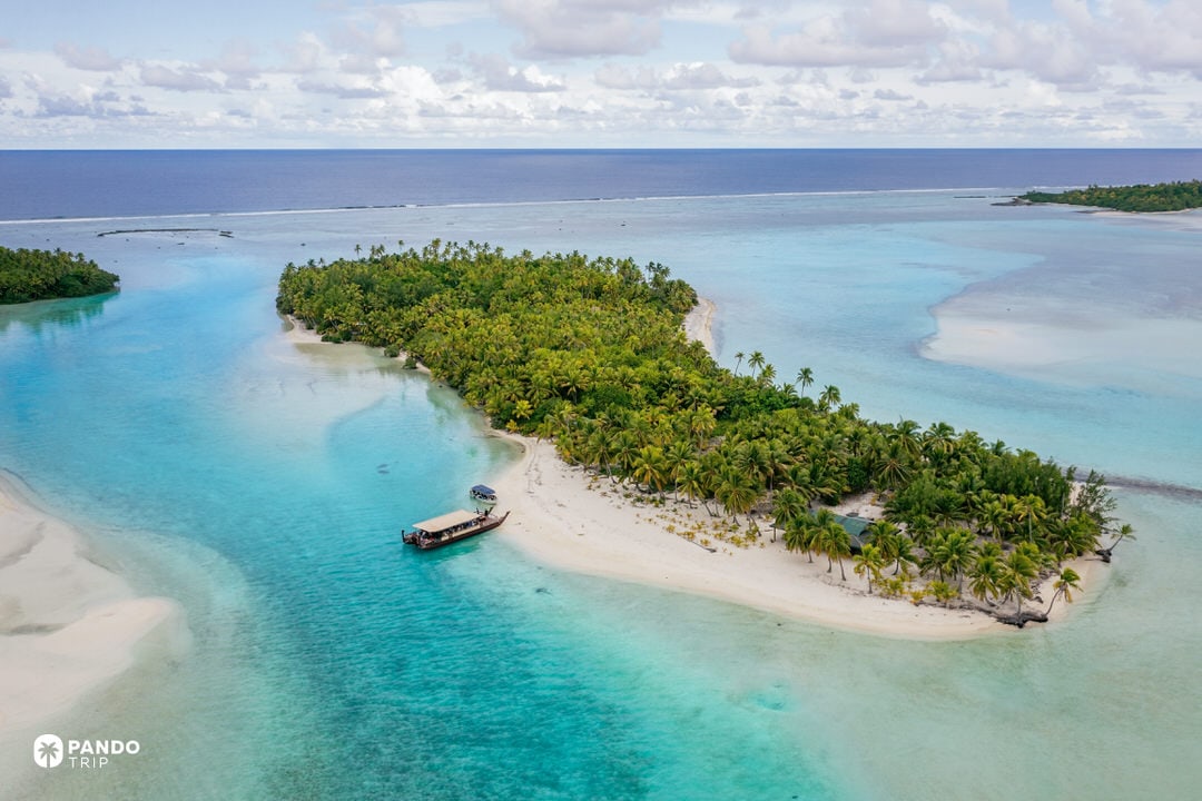Aerial view of One Foot Island surrounded by turquoise Aitutaki Lagoon in the Cook Islands