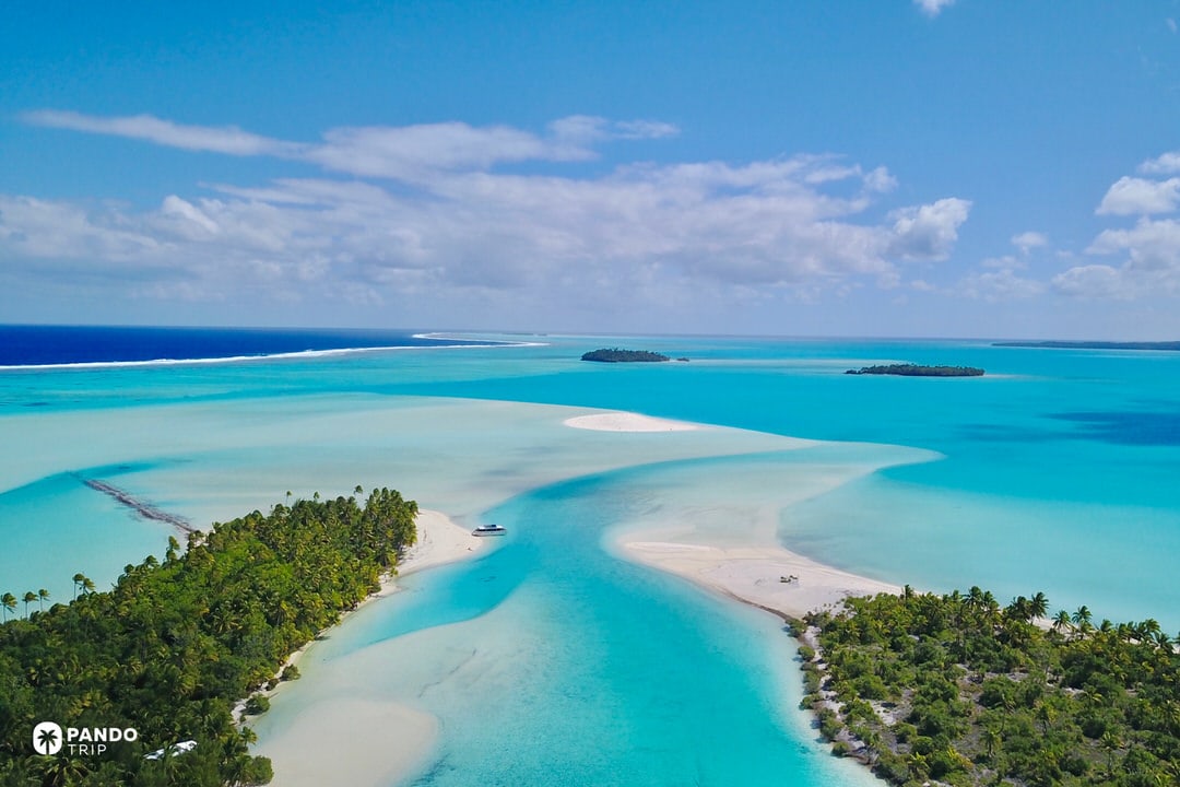 Aitutaki Lagoon with turquoise sandbars and motu islands in the Cook Islands