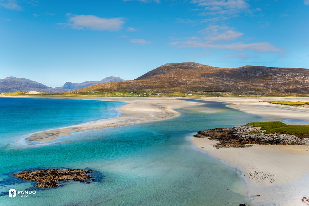 Bright turquoise water and sandbars beneath blue skies at Luskentyre.