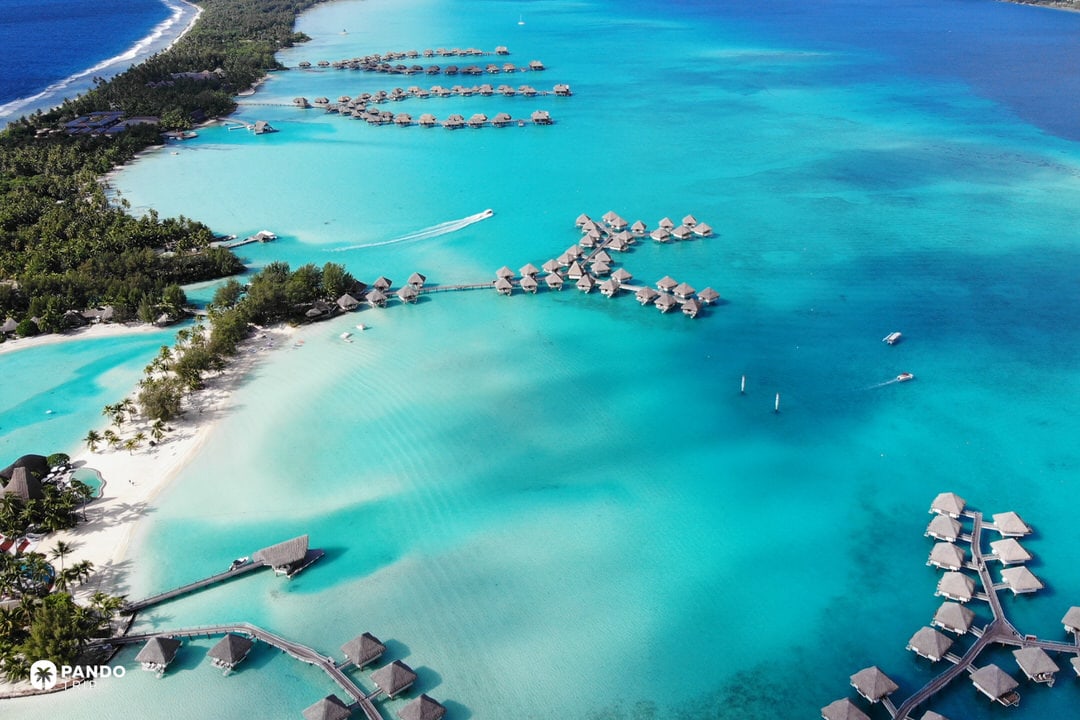 Overwater resort bungalows in Bora Bora’s turquoise lagoon, French Polynesia