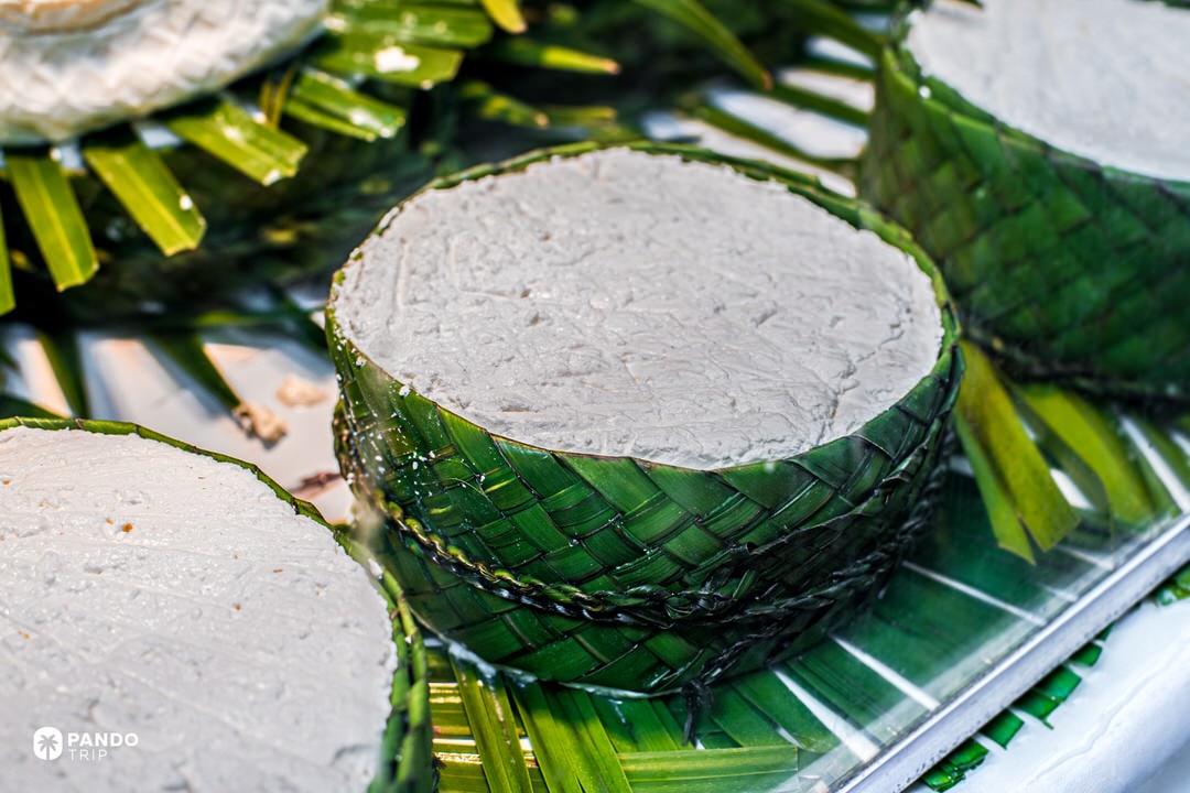 Fresh rounds of jben goat cheese wrapped in green leaves, a traditional specialty from the Rif Mountains near Chefchaouen