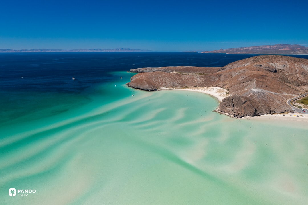 Aerial drone view of Puerto Balandra lagoon and white sandbars near La Paz, Mexico