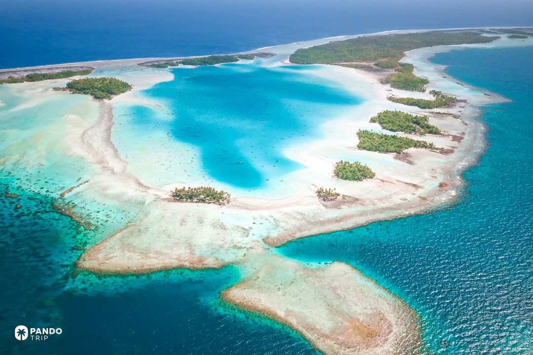 Aerial view of Rangiroa atoll lagoon in French Polynesia with turquoise water and motu islets